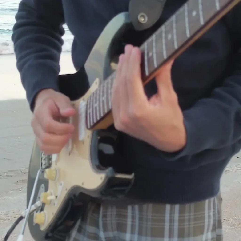 Get Lucky Guitar Loop guitarist playing by the ocean