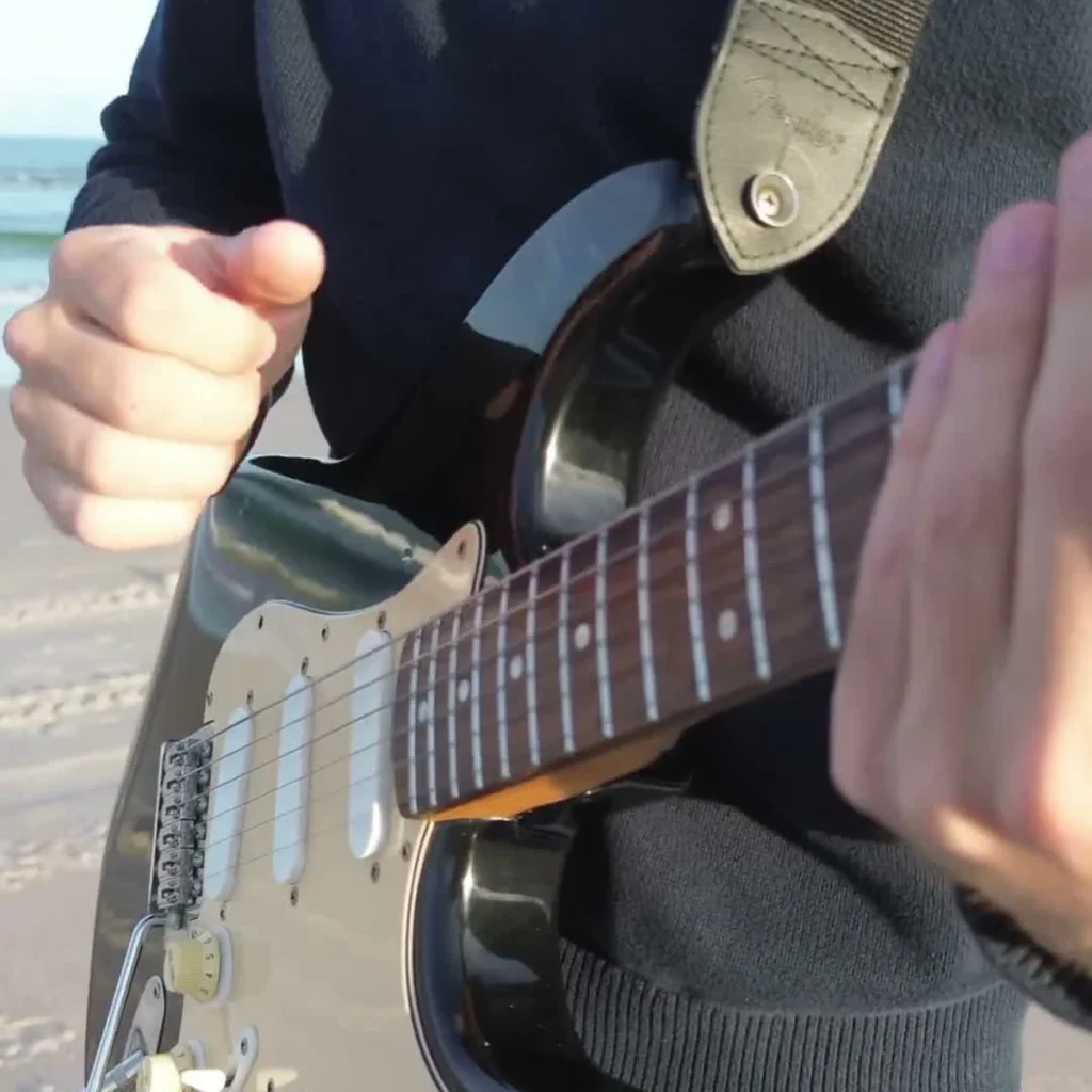 Smooth Operator Guitar Loop guitarist at the ocean with a single guitar and loop station