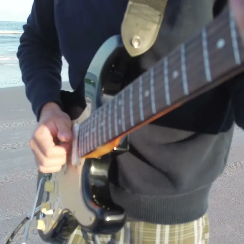 Englishman In New York Guitar Loop guitarist at the beach one guitar loop session