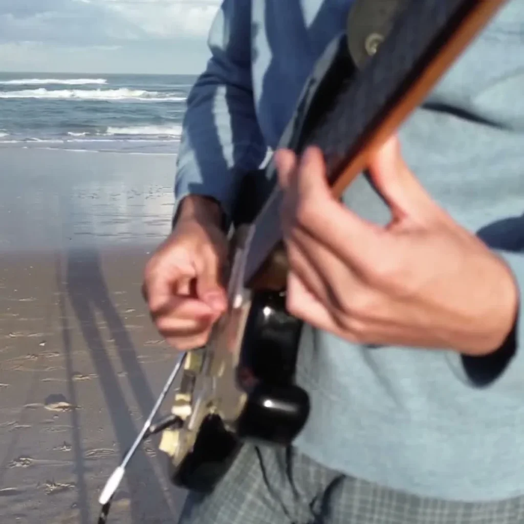 Ring My Bell Guitar Loop guitarist at the beach playing one guitar loop session