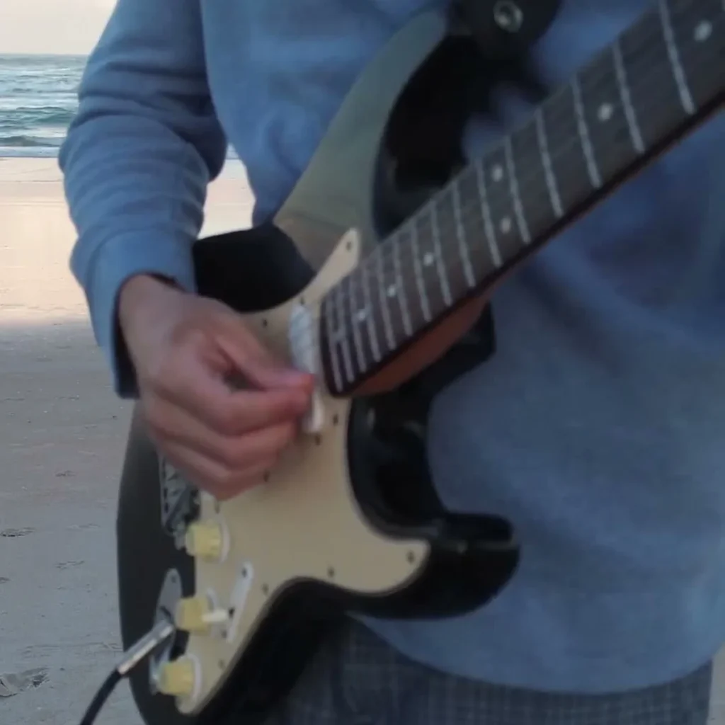 Clint Eastwood Guitar Loop guitarist at the beach one guitar loop session