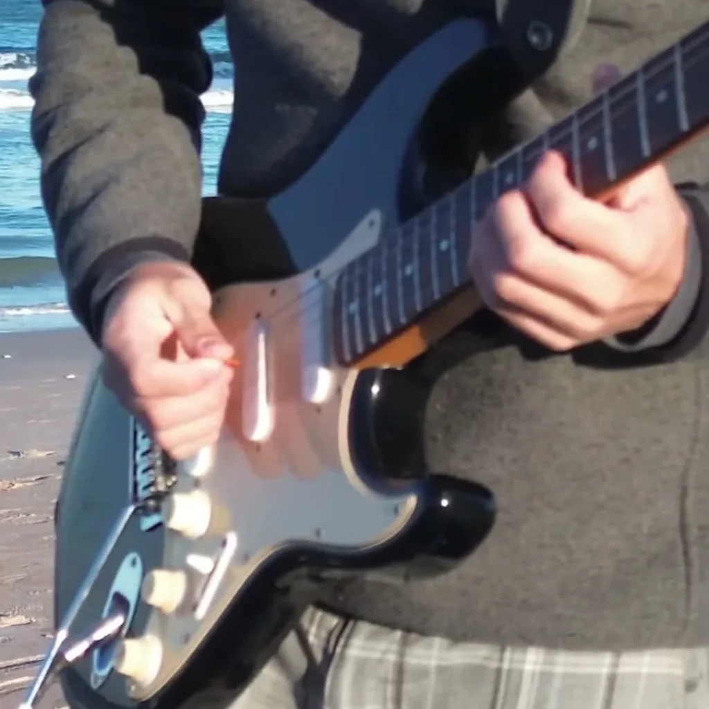 Sunshine of Your Love Guitar Loop guitarist performing at the ocean