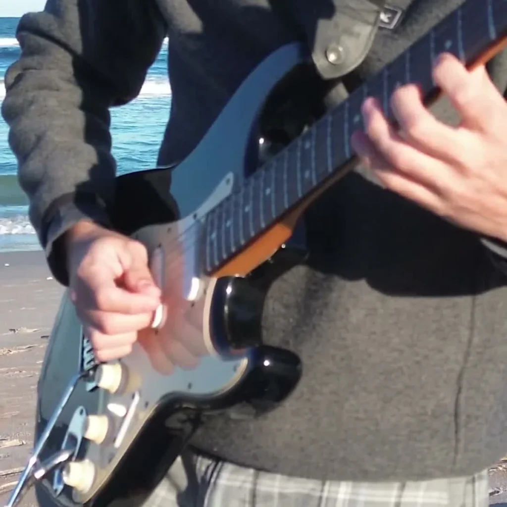 Don't Stop Til You Get Enough Guitar Loop - guitarist at the beach, one guitar loop session by the ocean